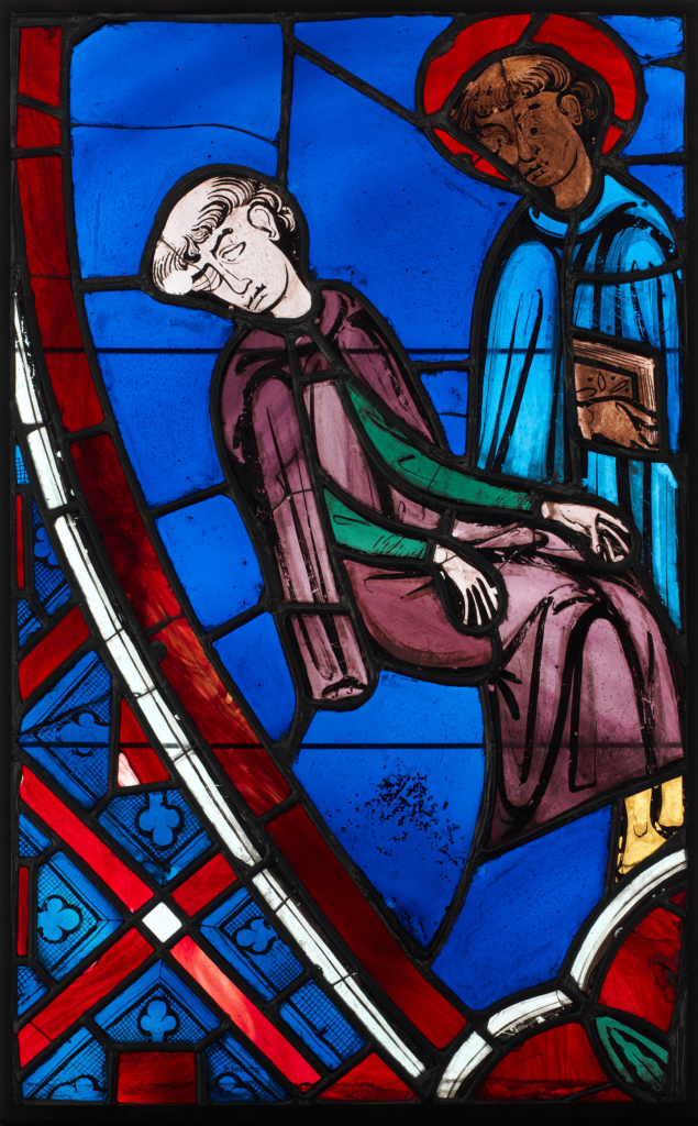 Bức tranh kính màu “Vision of Saint Germain of Paris” (Khải tượng của Thánh Germain ở Paris), năm 1245–1247, của một nghệ sĩ khuyết danh người Pháp. Kính nồi kim loại (Pot-metal glass), sơn thủy tinh; kích thước: 25 1/8 inch (~64cm) x 15 3/4 inch (~40cm). Bộ sưu tập Cloisters, Bảo tàng Nghệ thuật Metropolitan, New York. (Ảnh: Tài liệu công cộng)